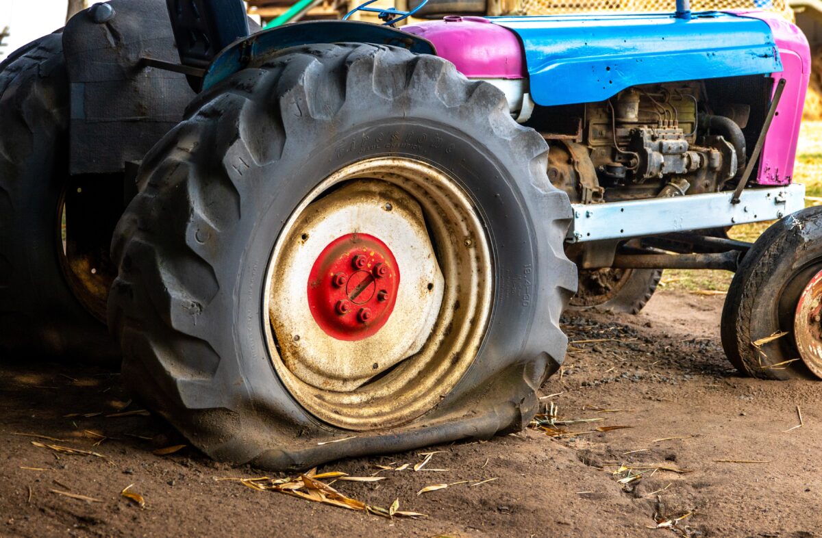 Tractor with a flat tyre